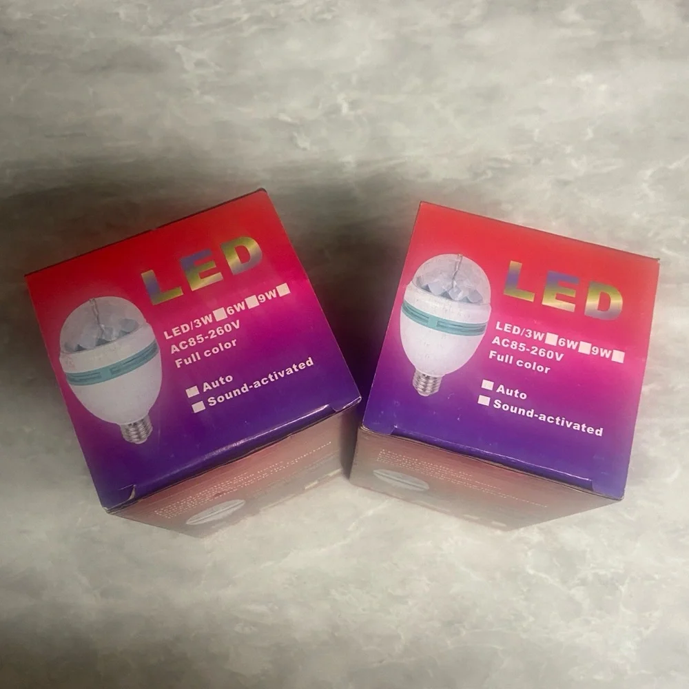 Two (2) pack RGB rotating LED light bulbs NIB